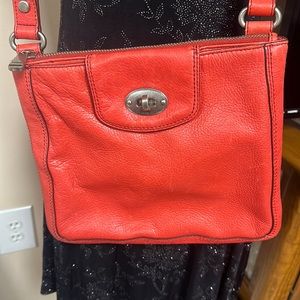 Red leather Fossil crossbody purse with adjustable strap. EUC